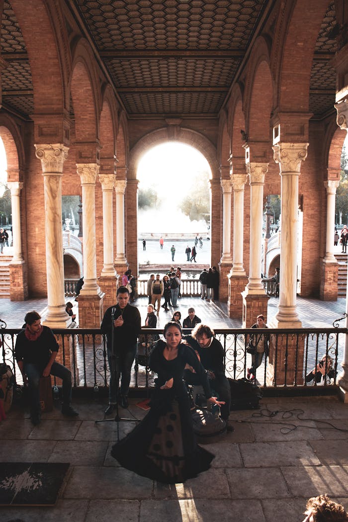 A vivid flamenco performance under arches at Plaza de España in Seville, Spain, capturing cultural artistry.